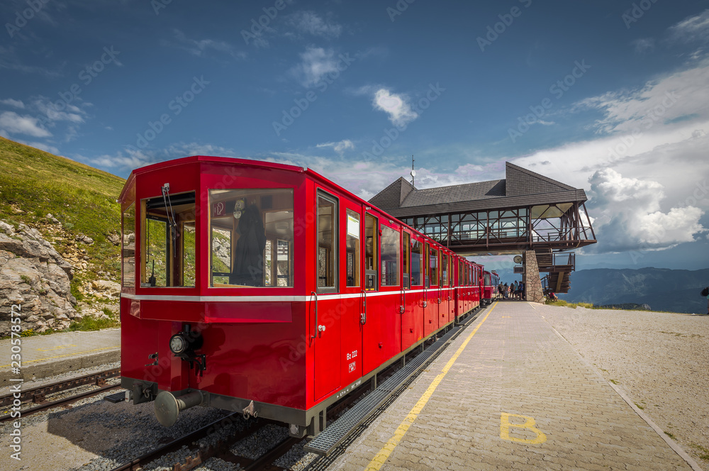 Red steam historic locomotive waiting in Schafbergspitze station near Salzburg, Upper Austria