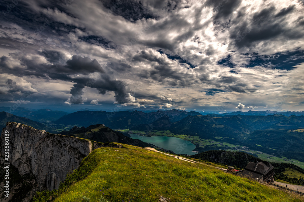 View on Wolfgang see from top of Schafberg on a sunny day with dramatic cloudy blue sky