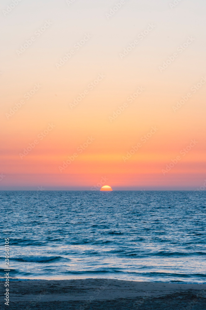 Sunset above Mediterranean sea coast