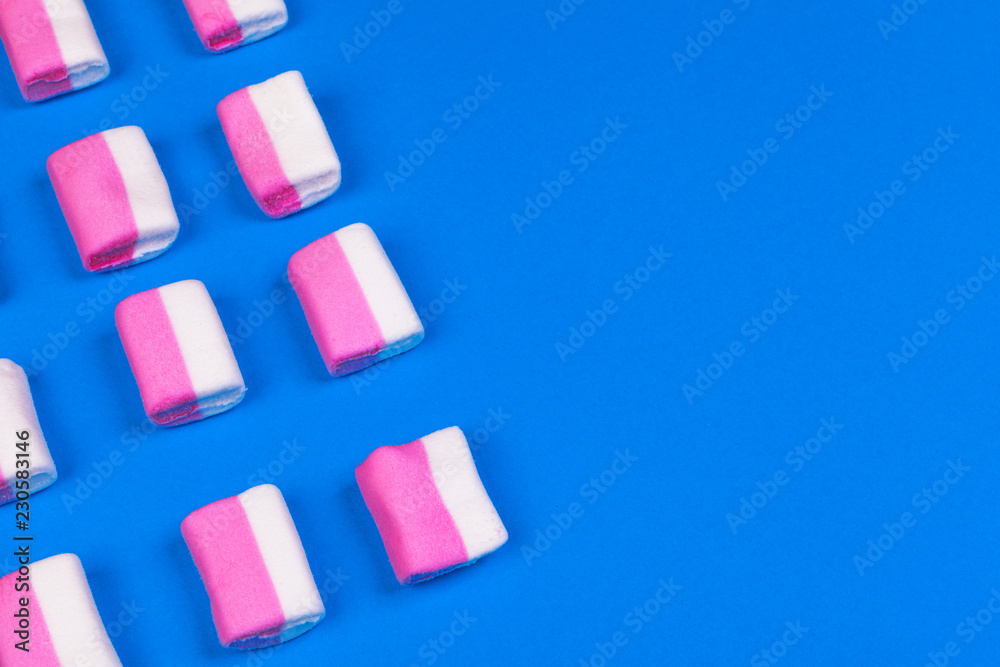 Marshmallows on blue background