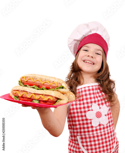 little girl cook with hot dogs fast food