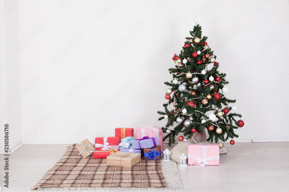 Christmas tree in white interior with toy decor