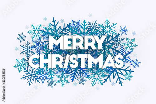 Merry Christmas word art concept with letters laying on snowflakes in the background. Abstract and trendy design.  photo