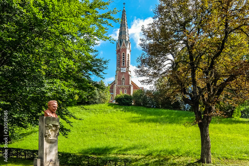 Murzzuschlag, Austria. View of Evangelic church (Evangelische Kirche Mürzzuschlag) in bright sunny day. photo