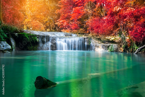 Amazing in nature, wonderful waterfall at autumn forest in fall season. 