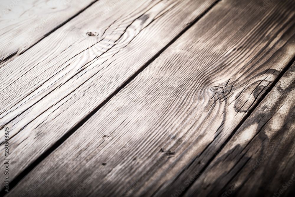 An old board with knots and chips. Wood. Background. Selective focus An old board with knots and chips. Wood. Background. Selective focus