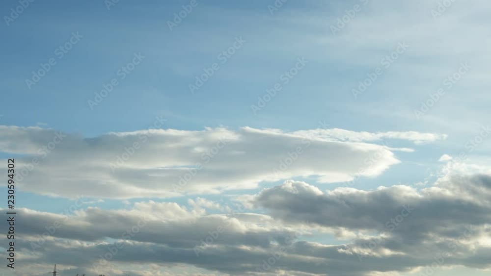 White and gray clouds floating on blue sky in the sun, panorama White and gray clouds floating on blue sky in the sun, panorama