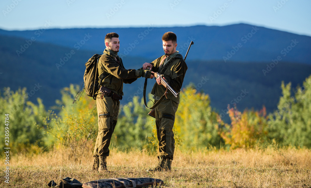 Men bearded hunters with rifle nature background. Experience and practice lends success hunting. How turn hunting into hobby. Guys hunting nature environment. Masculine hobby activity. Hunting season Men bearded hunters with rifle nature background. Experience and practice lends success hunting. How turn hunting into hobby. Guys hunting nature environment. Masculine hobby activity. Hunting season
