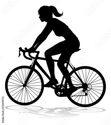 A woman bicycle riding bike cyclist in silhouette © Christos Georghiou
