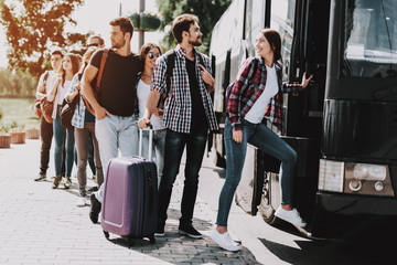 Group of Young People Boarding on Travel Bus