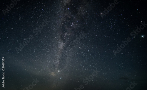 Fototapeta Naklejka Na Ścianę i Meble -  Night sky with stars and milky way. Subject is blurred, low key and noise.