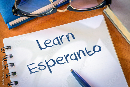 Learn Esperanto written in a notepad. Education concept photo