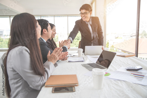 businesspeople meeting and discussing with graph and chart and showing successful result using as background (concept of successful and achievement)