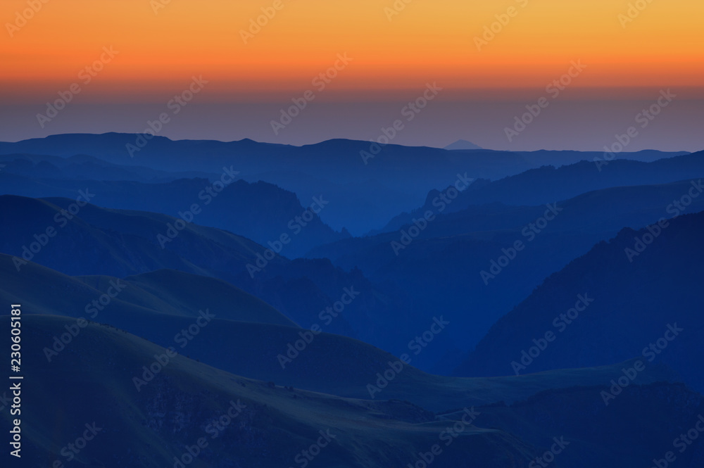 Early morning in the mountain area. Dawn over the mountains and valleys of the North Caucasus in Russia.