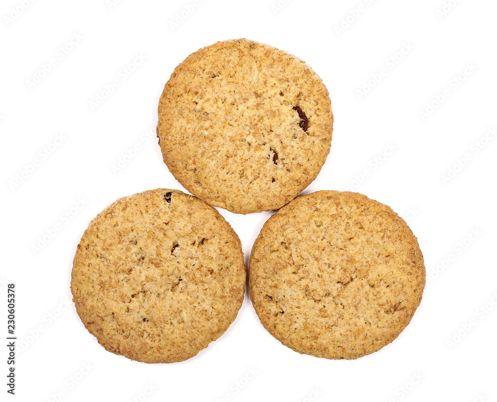 Round whole wheat biscuits, cookies with raisins isolated on white background, top view Round whole wheat biscuits, cookies with raisins isolated on white background, top view