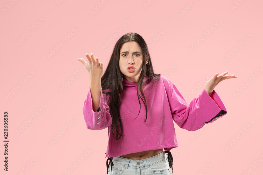 Argue, arguing concept. Beautiful female half-length portrait isolated on pink studio backgroud. Young emotional surprised woman looking at camera.Human emotions, facial expression concept. Argue, arguing concept. Beautiful female half-length portrait isolated on pink studio backgroud. Young emotional surprised woman looking at camera.Human emotions, facial expression concept.