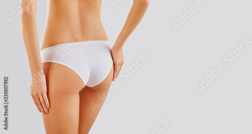 Slim woman's body in shape. Close-up of butt girl in underwear.