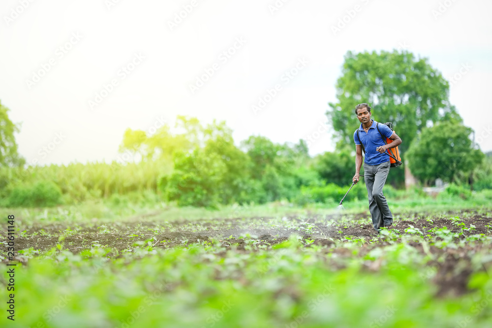 farmer spraying pesticides