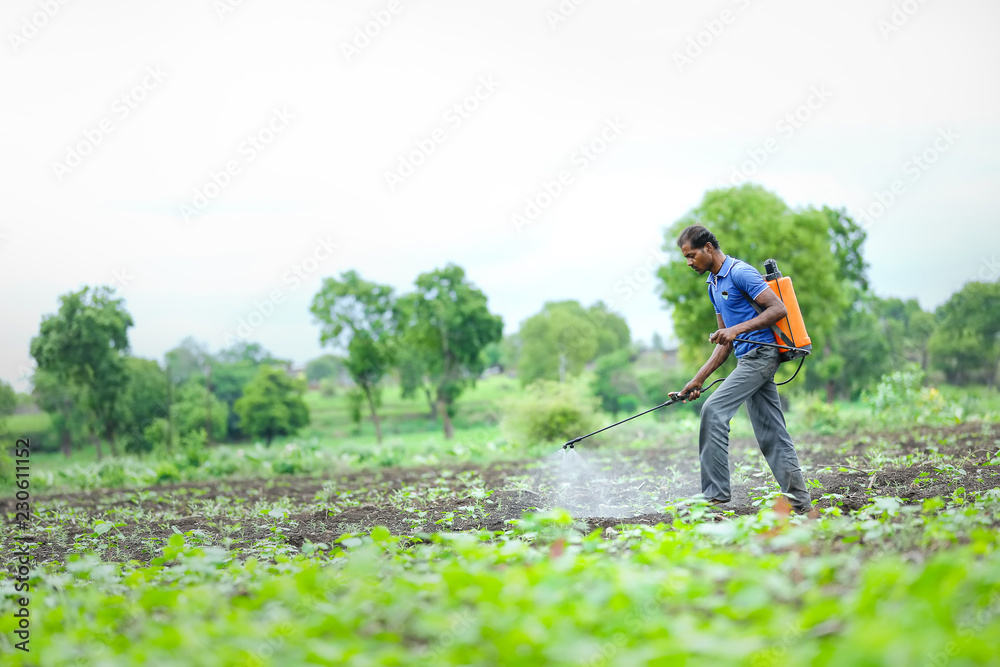 Fototapeta premium farmer spraying pesticides