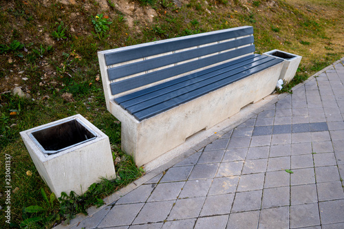 concrete bench with trashcan