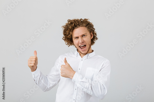 Portrait of a confient young man with curly hair photo