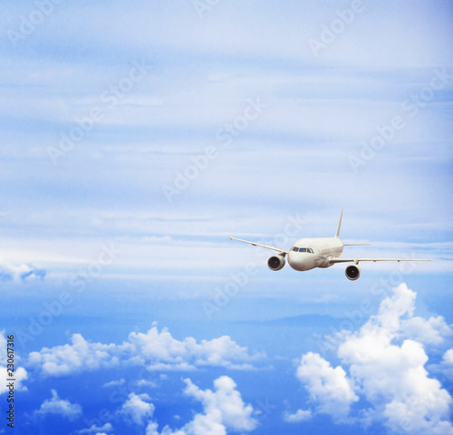 airplane in blue sky  travel concept