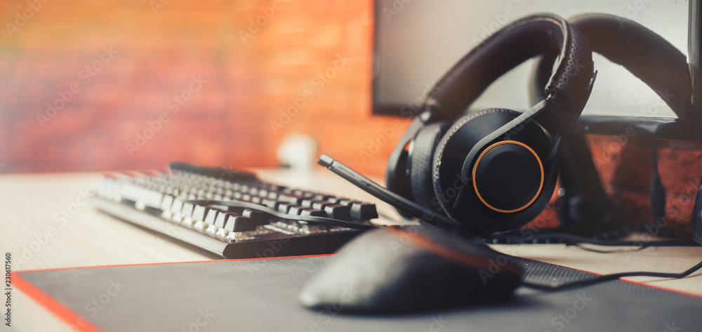 Gaming arena background with mouse gear headphones computer, focuse on headphones selected focuse long banner