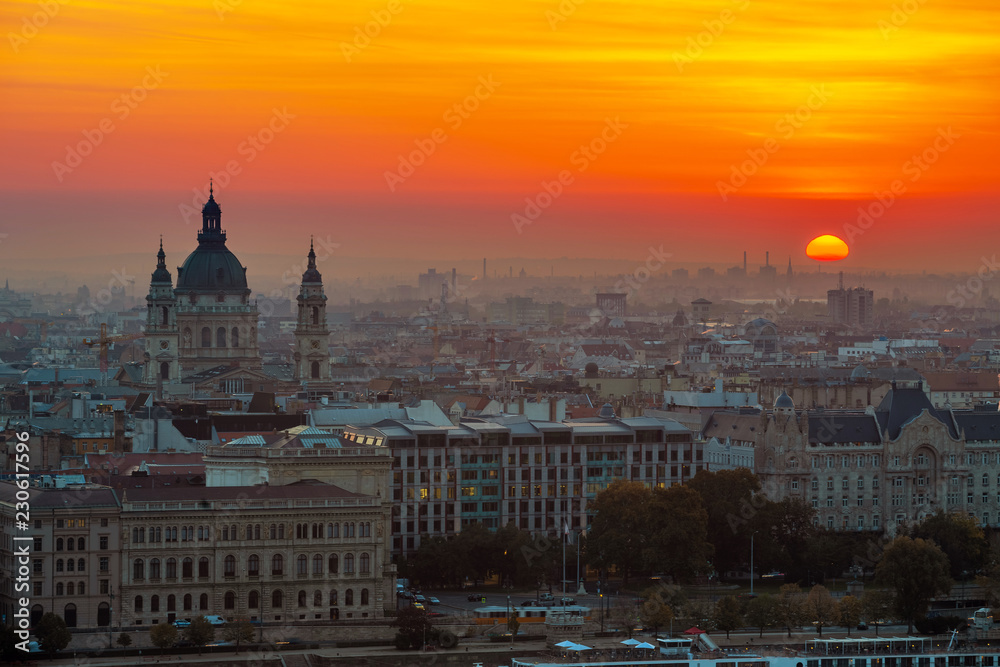 Budapest, Hungary - Beautiful golden sunrise over Budapest with St. Stephen's Basilca and the skyline of Pest