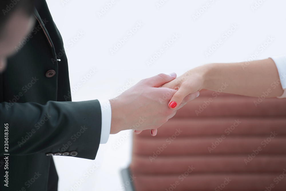Obraz premium closeup .welcoming handshake of a businessman and business woman