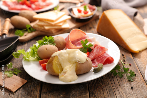 Canvas Print raclette cheese with meat and potato