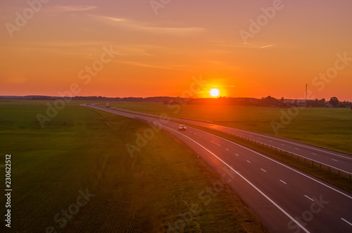 car driving on the highway at sunset © yaroslav1986