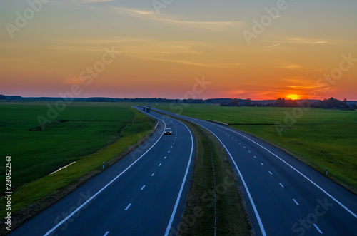 car driving on the highway at sunset © yaroslav1986