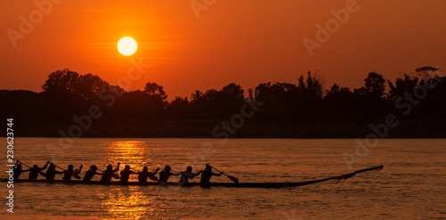 Training for victory/Thai rowing boat is training to compete in the evening. , Photography, silhouette