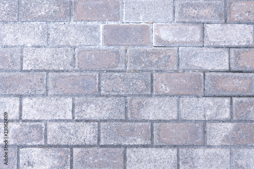 Gray background with pink tones brick wall background. Construction texture pattern