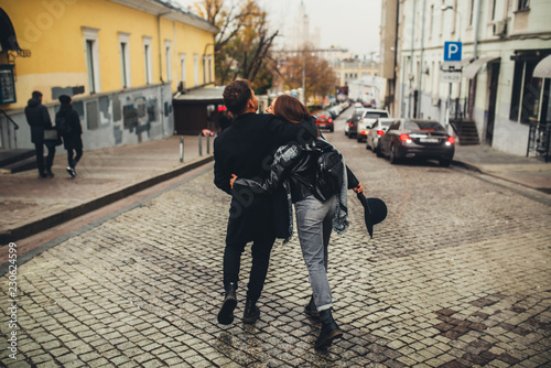 young couple walks on the city © Kirill