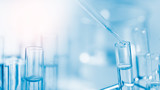 Dropping chemical liquid to test tube, laboratory research and development concept. scientist sample chemistry or medicine test