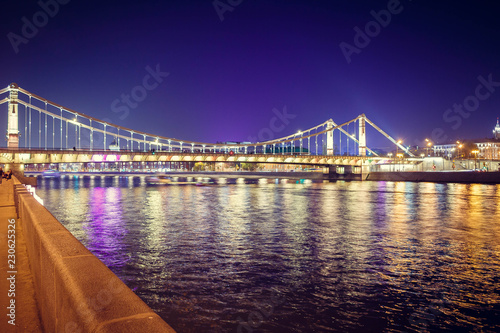 The long beautiful bridge across the river in the evening. © PhotoBank
