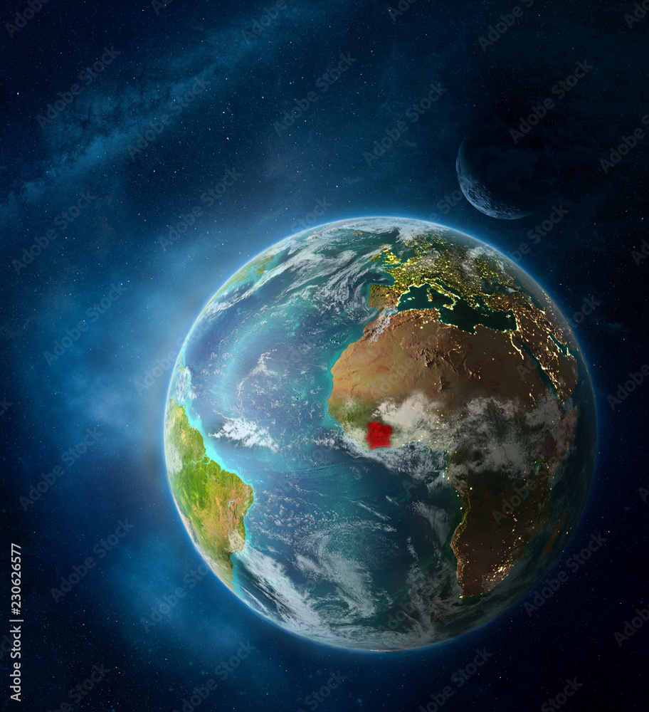 Ivory Coast from space on Earth surrounded by space with Moon and Milky Way. Detailed planet surface with city lights and clouds. Ivory Coast from space on Earth surrounded by space with Moon and Milky Way. Detailed planet surface with city lights and clouds.