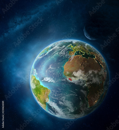Fototapeta Naklejka Na Ścianę i Meble -  Liberia from space on Earth surrounded by space with Moon and Milky Way. Detailed planet surface with city lights and clouds.
