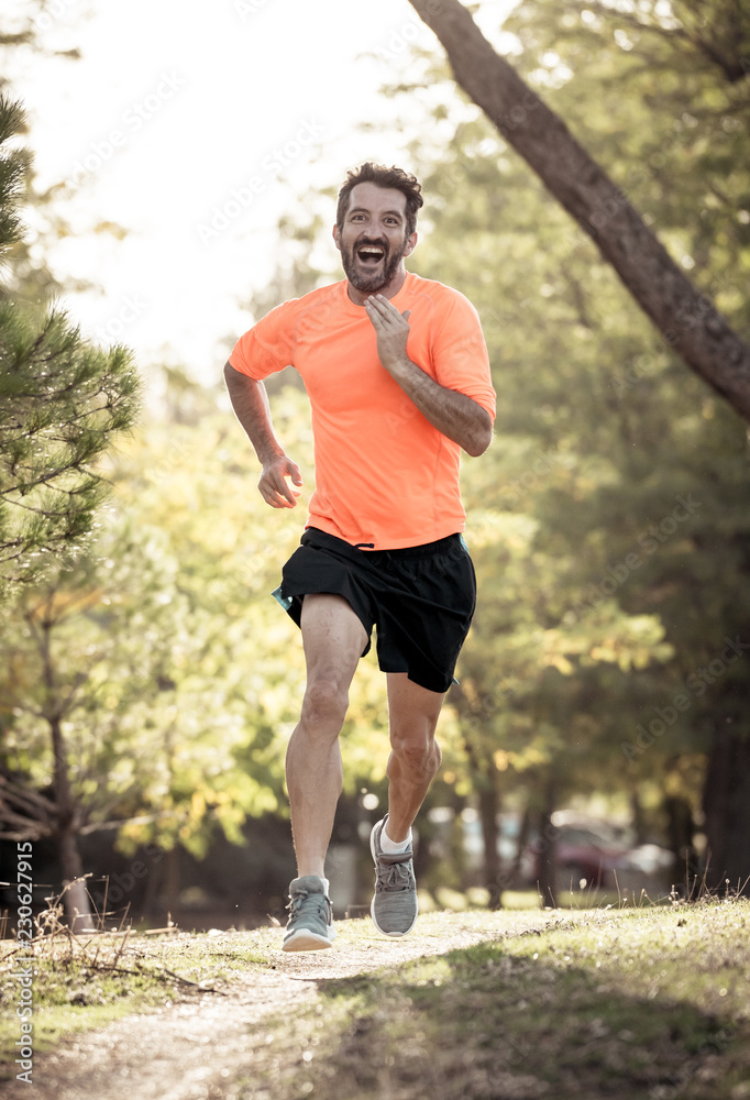 Athletic young man running in the nature at sunset in autumn in fitness Healthy lifestyle Athletic young man running in the nature at sunset in autumn in fitness Healthy lifestyle