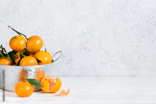 White background with fresh ripe tangerines © alinakho