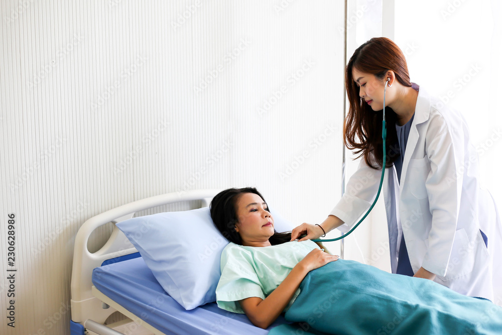 Beautiful Smiling medical doctor woman with stethoscope patient discussing,Healthcare concept. Beautiful Smiling medical doctor woman with stethoscope patient discussing,Healthcare concept.