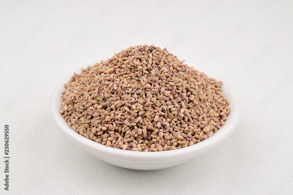 Ajwain Also Know as Ajowan, Caraway or Trachyspermum Ammi on ceremic bowl Isolated on White Background Ajwain Also Know as Ajowan, Caraway or Trachyspermum Ammi on ceremic bowl Isolated on White Background