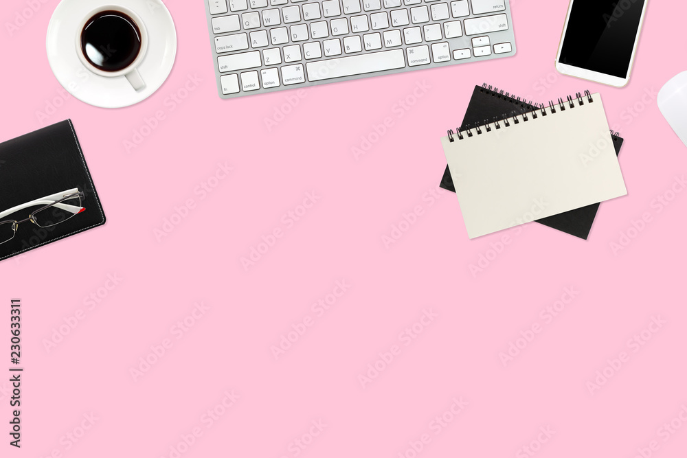 flat lay or top view workspace office pink desk with laptop computer, coffee cup and smartphone using for business background flat lay or top view workspace office pink desk with laptop computer, coffee cup and smartphone using for business background