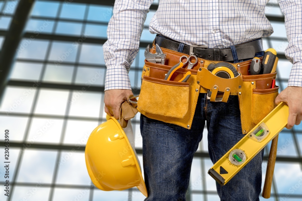 Worker with a tool belt. Isolated over Worker with a tool belt. Isolated over