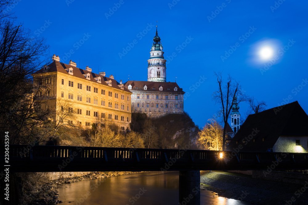 Castle and chateau in Cesky Krumlov at night, Chateau Cesky Krumlov with bridge and Vltava River, Czech Republic