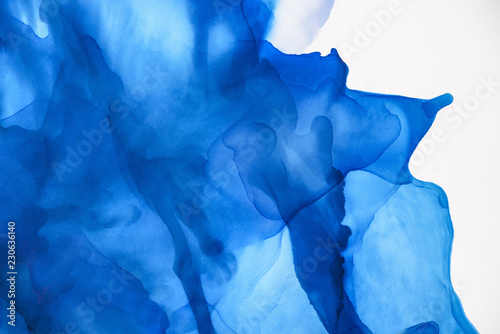 beautiful blue splashes of alcohol ink as abstract background