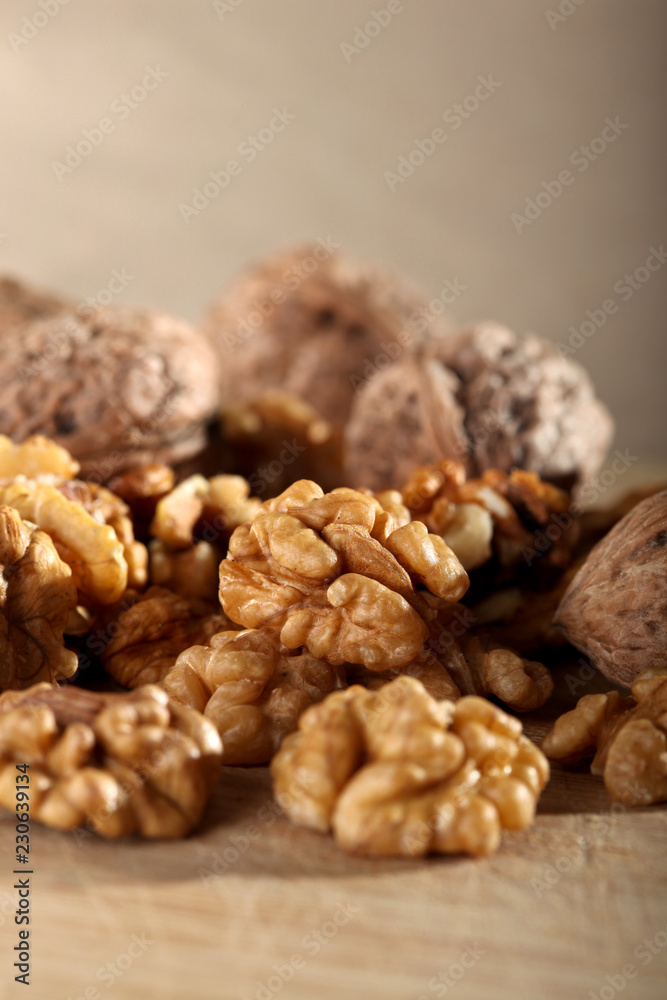 Close up of walnuts on the wooden board Close up of walnuts on the wooden board