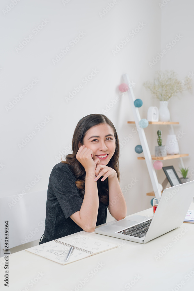 Beautiful young woman working from home Beautiful young woman working from home