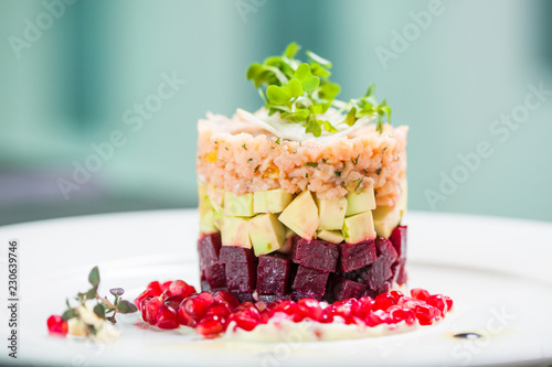 Vegan dish with beet, zucchini and pomegranate